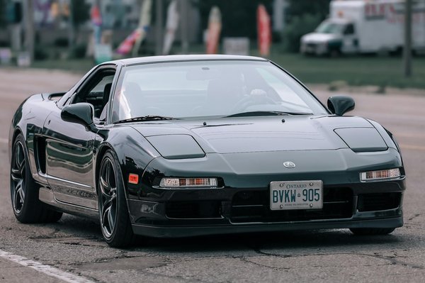 Quels sont les avantages des guidons réglables pour une moto de touring sur de longues distances ?